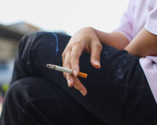 hand-holding-a-burning-cigarette-outside-dealing-2023-11-27-05-11-05-utc 1 (1)